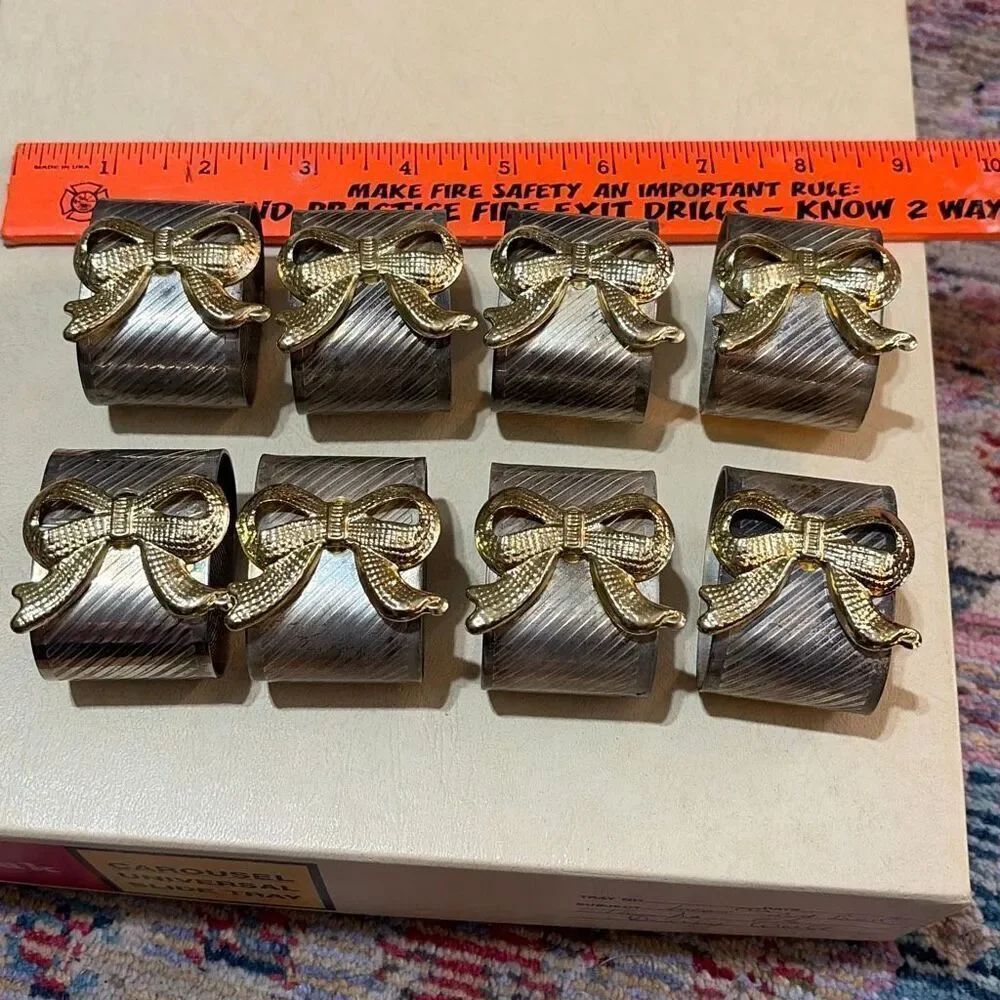 Napkin rings by Davco Silver with golden bows eight pieces